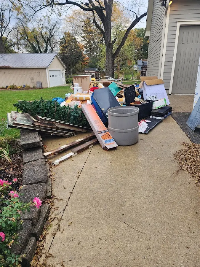 Dumpster being loaded with debris for 30 Yard Dumpster Rental in Decatur
